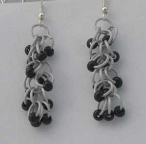 Anodized aluminum rings and glass beads colors: frost, black beads weave: shaggy loops size: 1  1/2