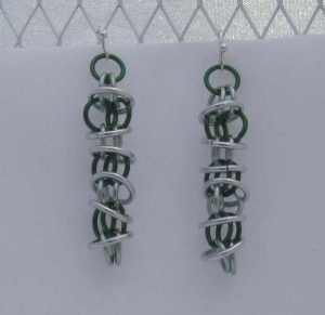 Anodized aluminum rings colors: green and seafoam weave: orbital size: 1  1/2