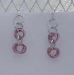 Anodized aluminum rings colors: pink and bright silver weave: rosettes size: 