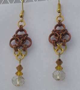 Anodized aluminum rings and crystal beads colors: bronze and gold weave: aura size: 