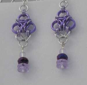 Anodized aluminum rings with beads colors: purple, lavender, and bright silver weave: aura size: 