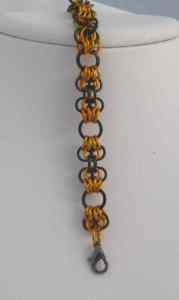 Anodized aluminum rings colors: black and orange weave: butterflies size: 3/8 x 7  3/4