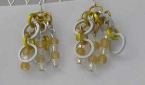Anodized aluminum rings and glass beads colors: frost, yellow, matte gold and silver beads weave: 1 in 1 size: 1  1/4